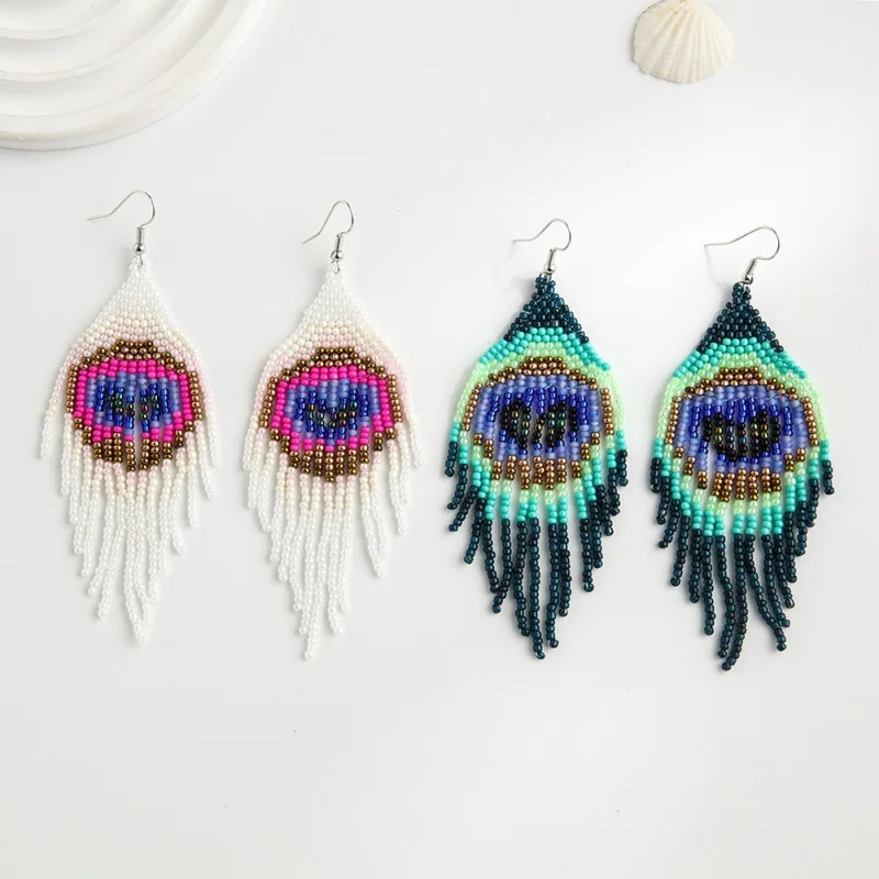 

Beaded earrings Tassel Originality Design Heart-shaped Eye Hand knitting Bohemia Alloy Tide Simple Rice bead earrings