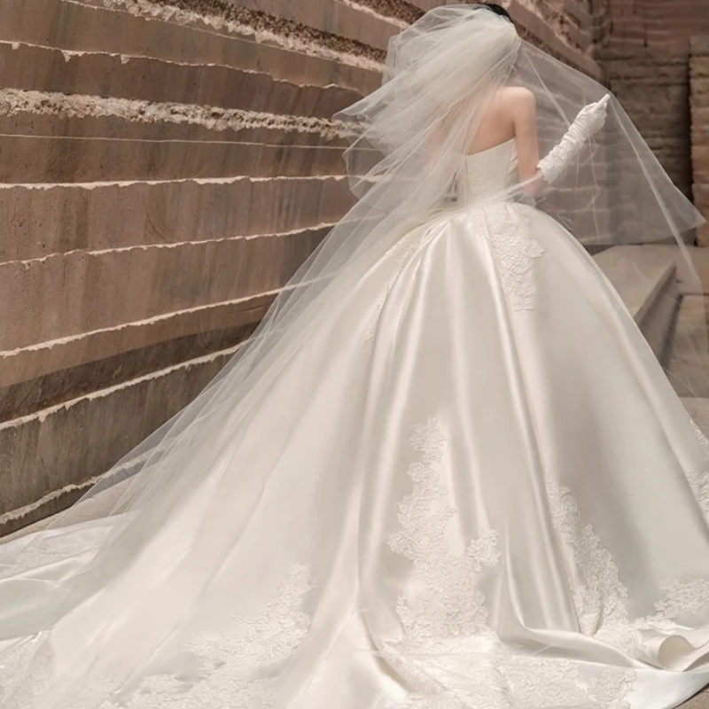 Custom Floor To Ceiling Large Trailing Bridal Gown with Strapless Satin and Lace Embroidery for The Bride's Main Wedding Dress