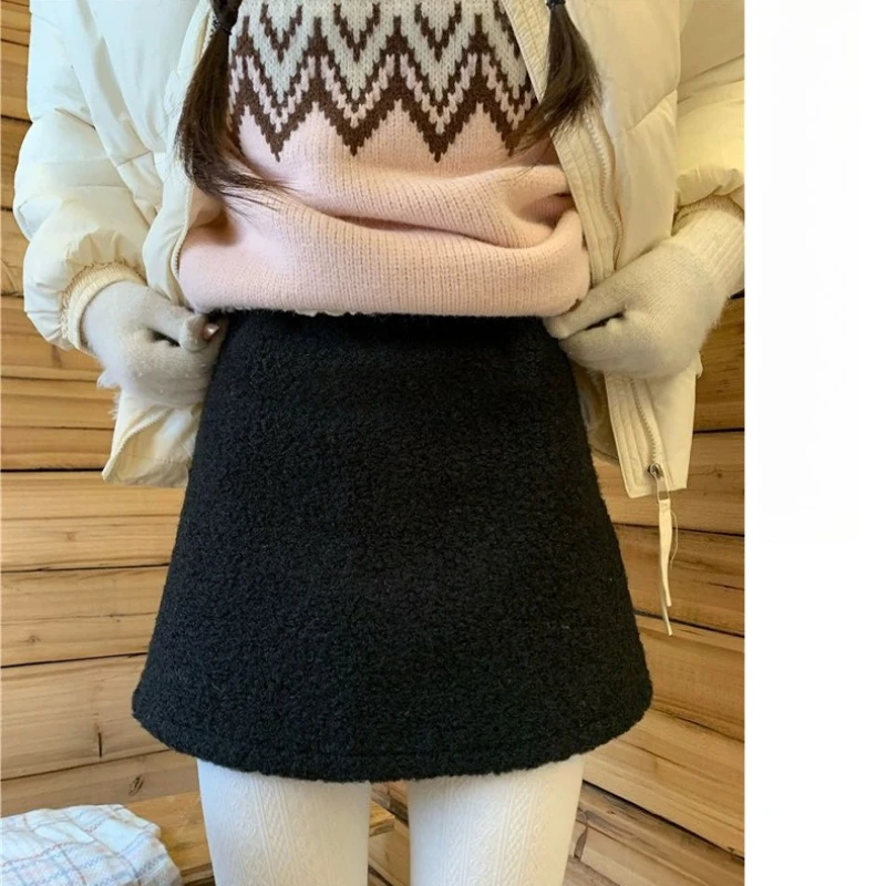 المرأة صوف الضأن تنورة بيضاء مرونة عالية الخصر الحلو عادية الصلبة سميكة أفخم تنورة الخريف الشتاء الكورية ألف خط تنورة قصيرة صغيرة