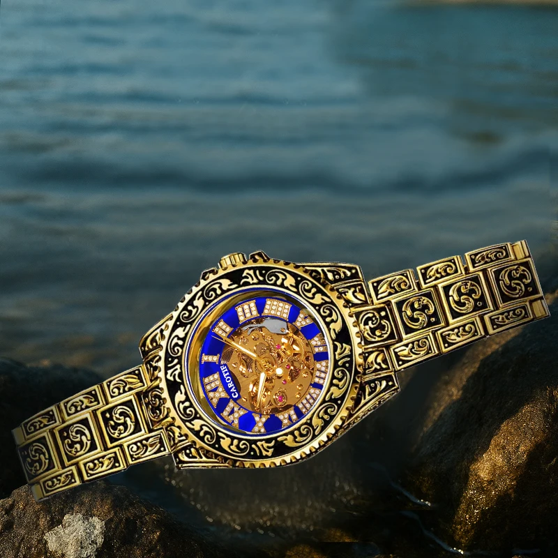 

A men's black and gold steel strap luxury vintage engraved engraved round large dial automatic mechanical watch