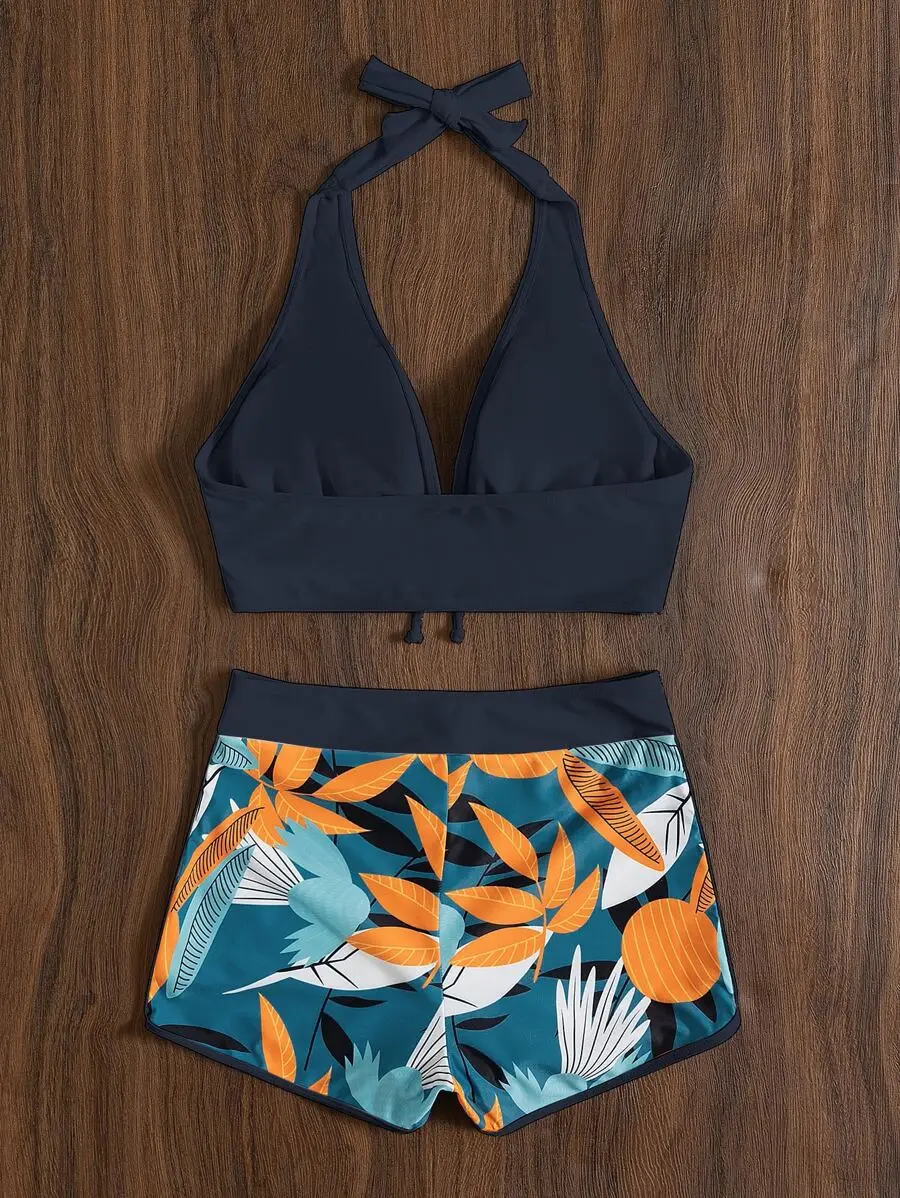 

Halter Tie-Neck Bikini Top Paired With Vibrant Tropical Leaf Print High-Waist Dolphin Swim Shorts For Summer Beachwear