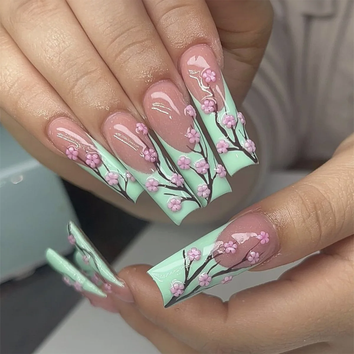 

24pcs Glossy Long Coffin Fake Nails Green French Tip Press on Nails with Pink Flower Design Spring Summer False Nails for Women