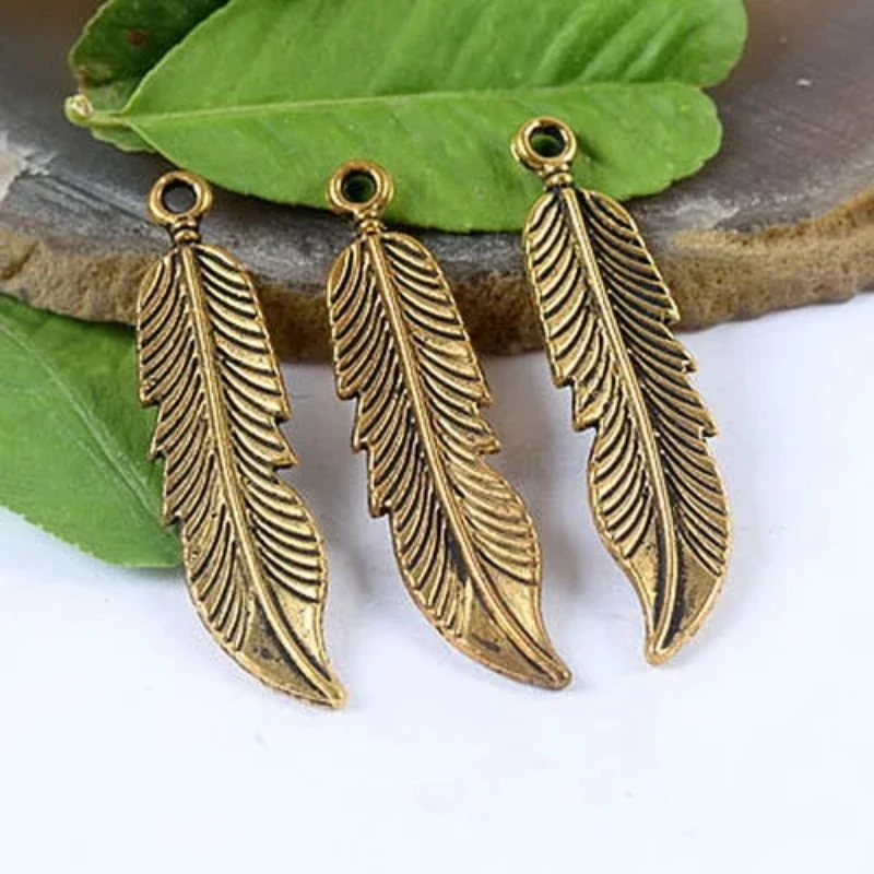 

10pcs dark gold-tone feather charms h1299