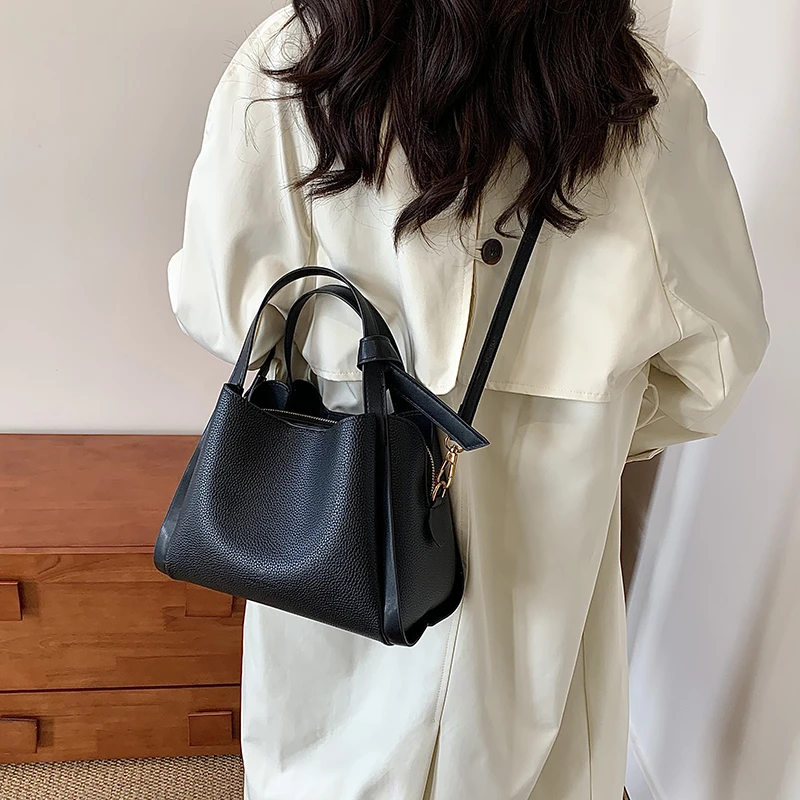 

Women's Handbag In Black Leather, Crossbody Shoulder Bag Design By Famous Designer, Luxury Brand Popular Classic Elegant