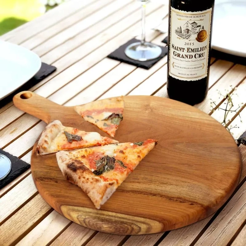 

The cutting board can be used as a pizza plate, square, teak, natural and meets food grade standards, in stock