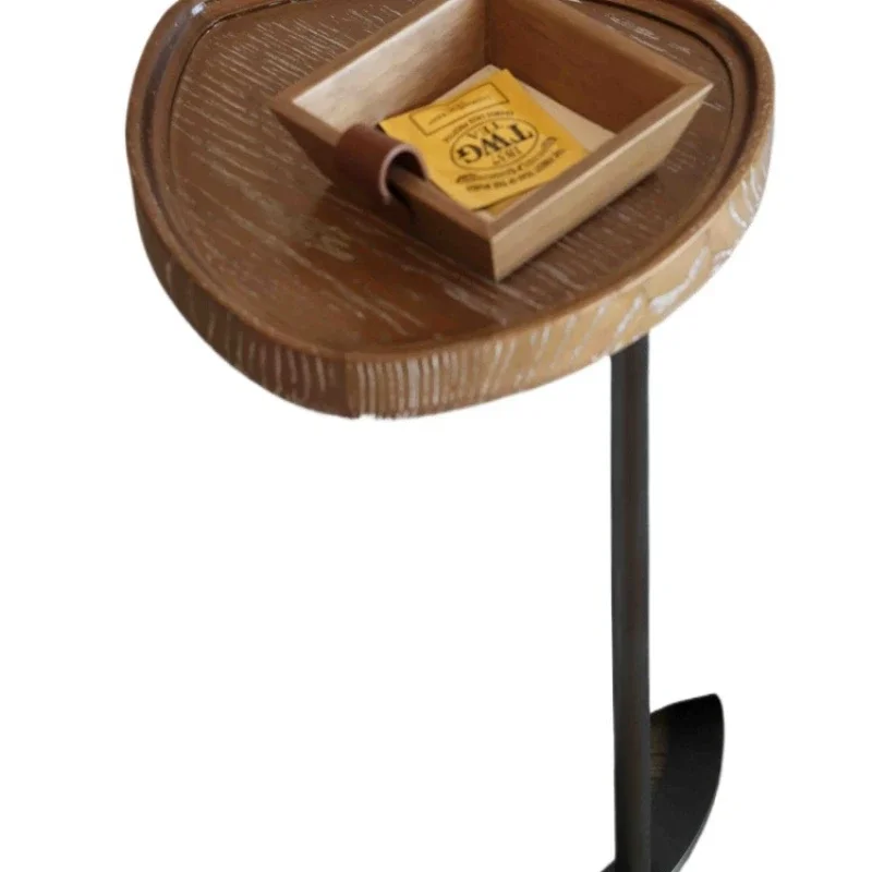 

a few tables of solid wood sofas, a small coffee table by the bed in the living room