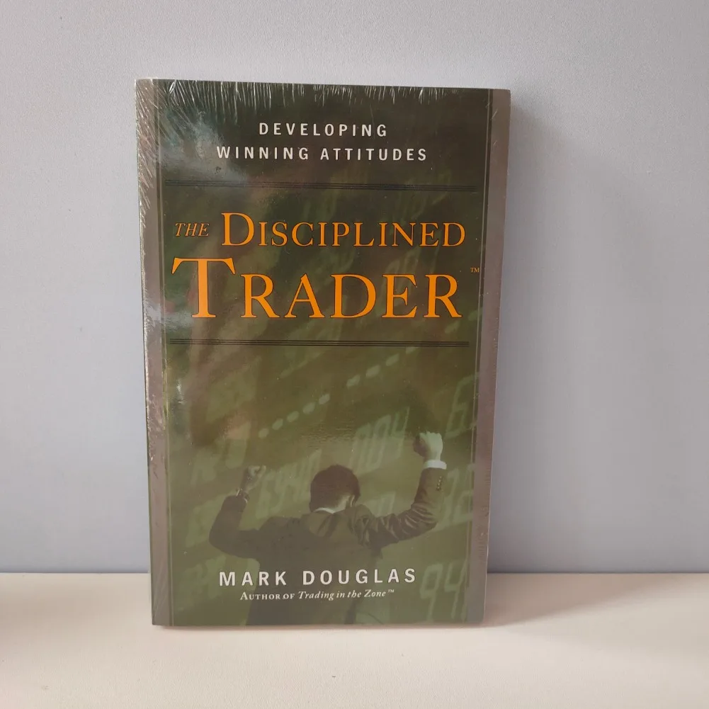 تجارة مارك دوغلاس في المنطقة وغلاف ورقي لكتب التاجر المنضبط باللغة الإنجليزية