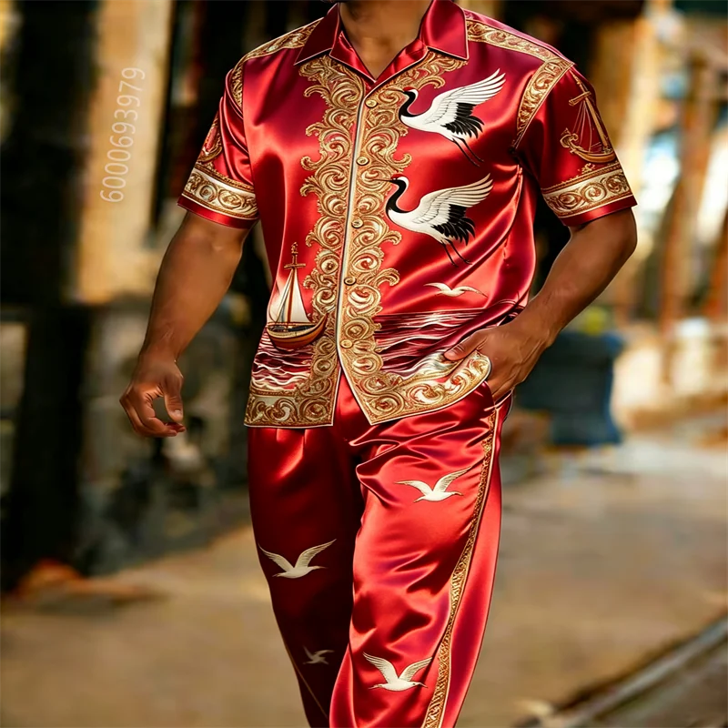 Men's luxury red satin short-sleeve collared shirt and trousers two-piece set; casual outfit featuring a gold crane and sailing