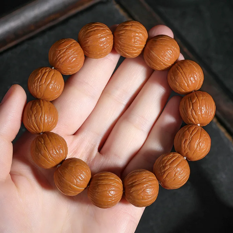 

Monkey Head Walnut Bracelet Treasure Bowl Natural Unprocessed Wild Original Seed Wealthy Phoenix Feather Single Circle Cultural