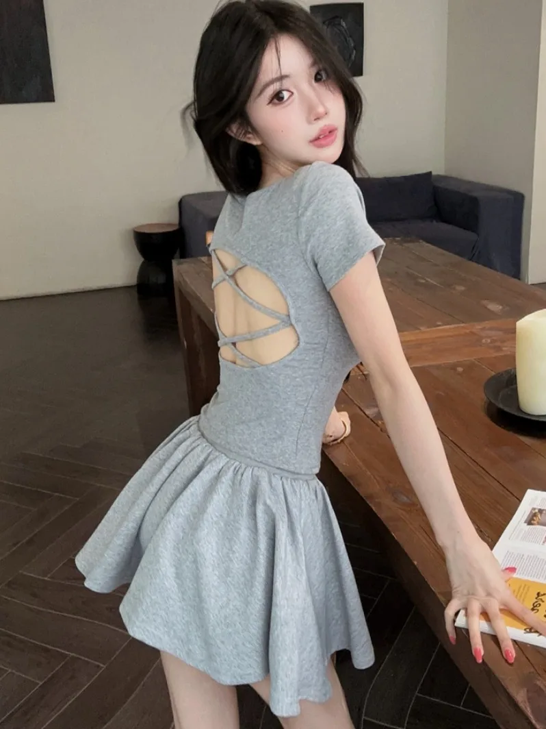 

Sexy Pure Desire Backless Short Sleeve T-Shirt High Waist Slimming Puffy Skirt Summer 2026 New Spicy Girl Two-Piece Set