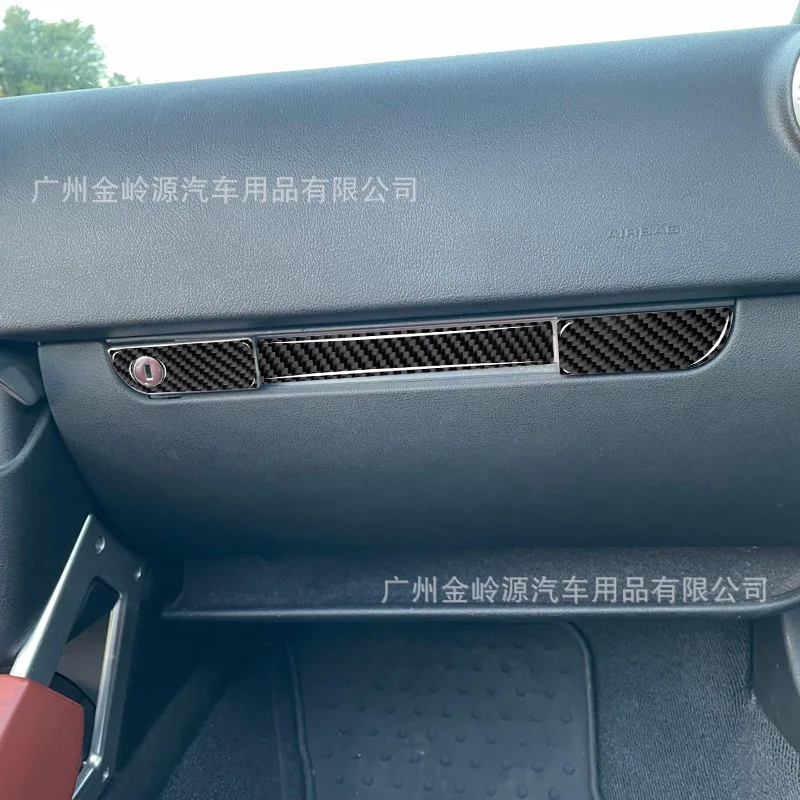 

Suitable for 01-06 Audi TT car interior modified carbon fiber co-driver storage lock panel decoration sticker