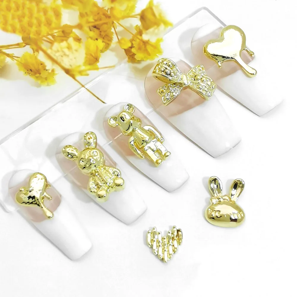 10 pz/lotto ciondoli per Nail Art in lega 3D metallo orso violento coniglio cuore liquido fiocco nodo decorazione per unghie di lusso forniture oro/argento