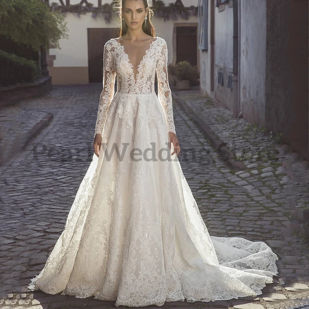 Precioso vestido de novia transparente de manga larga con apliques en el pecho, ilusión de botones en la espalda, falda de encaje elegante, vestidos de novia de matrimonio