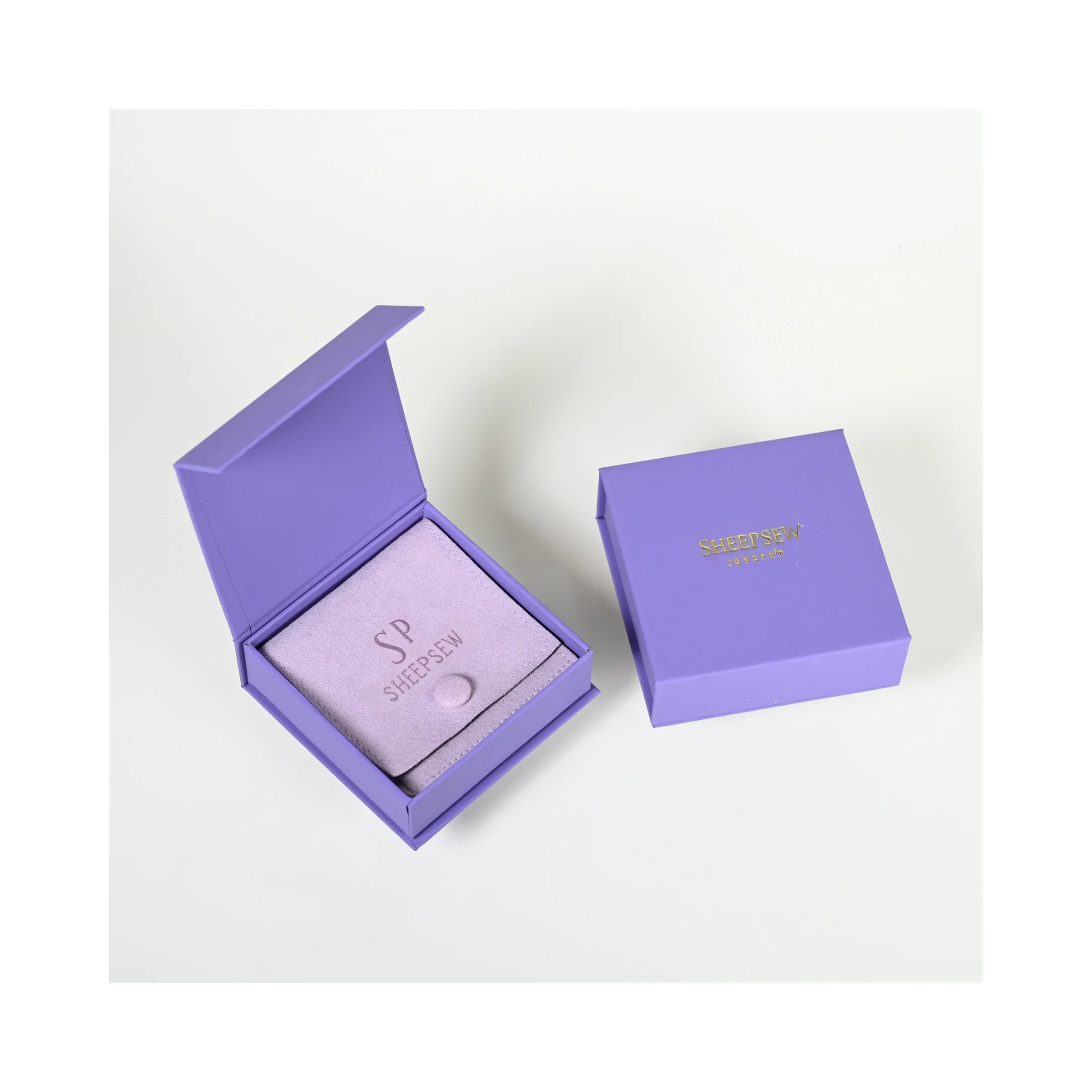 

Elegant Purple Microfiber Flip Button Jewelry Pouch Stamping Gold Logo Magnetic Box with Foam Insert Jewelry Package