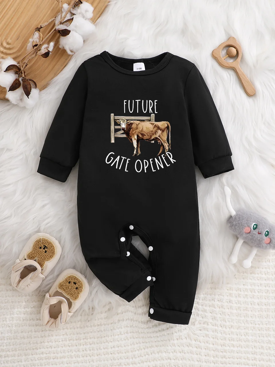 A baby long-sleeved onesie with interesting letter prints. It features a buttoned design for easy putting on and taking off