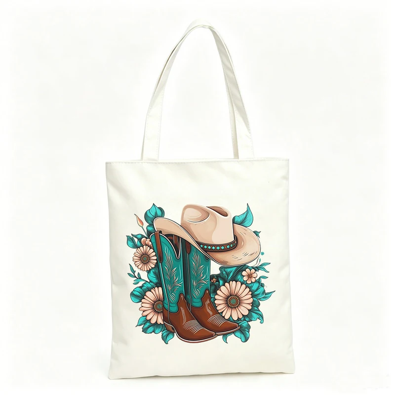 Women's Western style canvas tote bag with cowboy boots and floral graphic, perfect for casual outings and daily use
