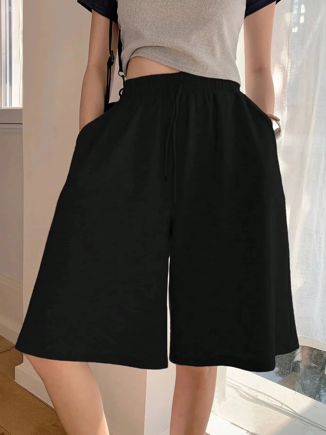 شورت نسائي كاجوال فضفاض للموسم بلون سادة وجيب مائل شورت رياضي من القطن الخالص ملابس الشارع الشهير سروال قصير للنساء