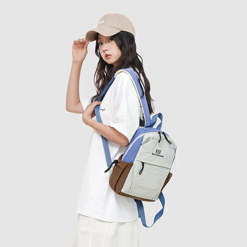 Nueva Mochila pequeña de viaje al aire libre a la moda, tela lavable, ligera, impermeable, bloque de Color,