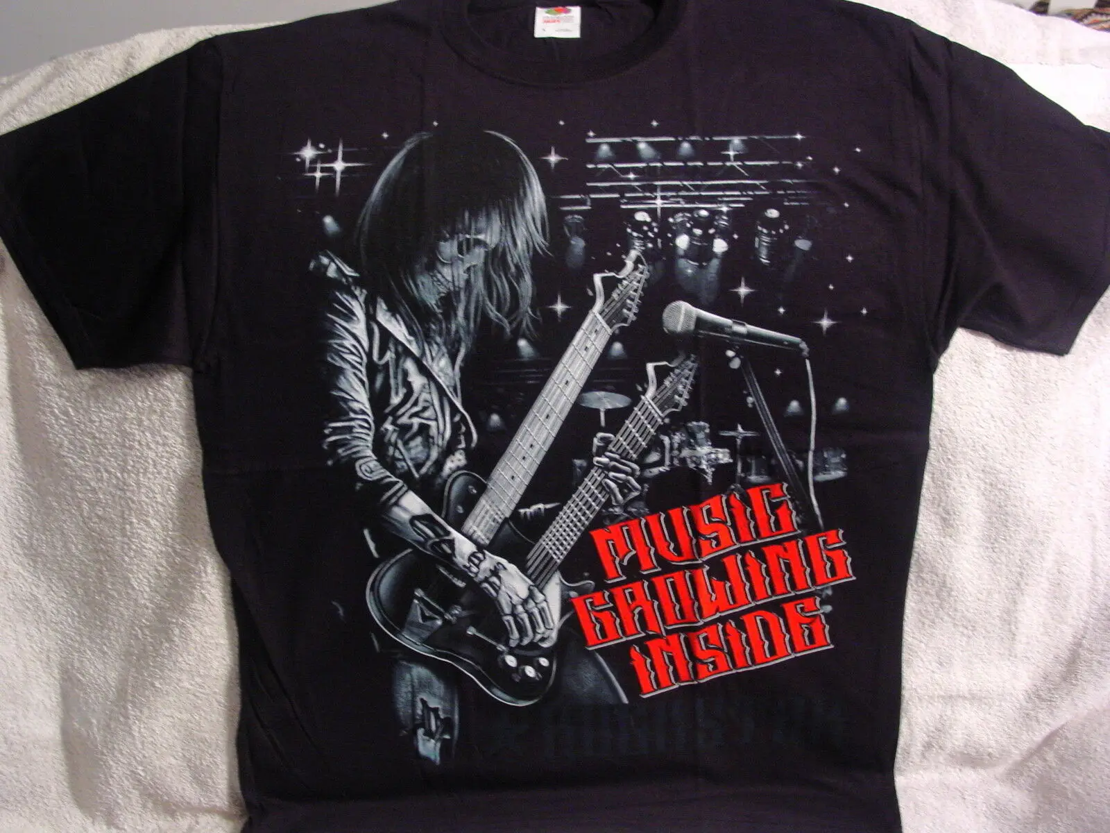 

SKELETON PLAYING GUITAR MUSIC GROWING INSIDE T-SHIRT