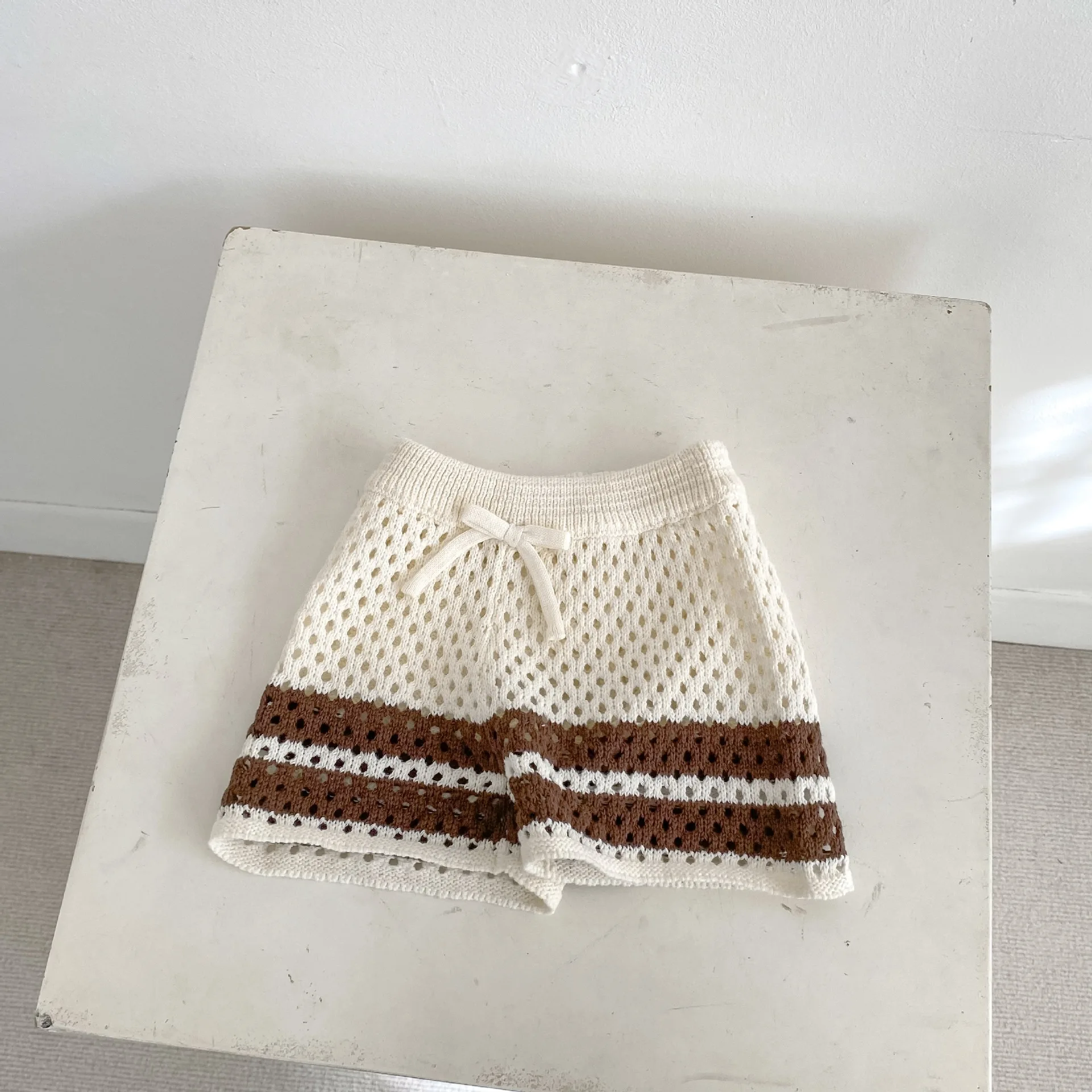 INS Summer Trendy New Knitted Hollow-Out Collared Button-Up Top Paired With Striped Color-Block Shorts