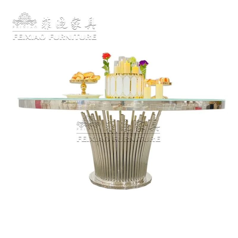 

Недорогие мебельные изделия для отелей на заказ: круглый обеденный стол для свадеб с серебристой стеклянной столешницей и основанием из нержавеющей стали.