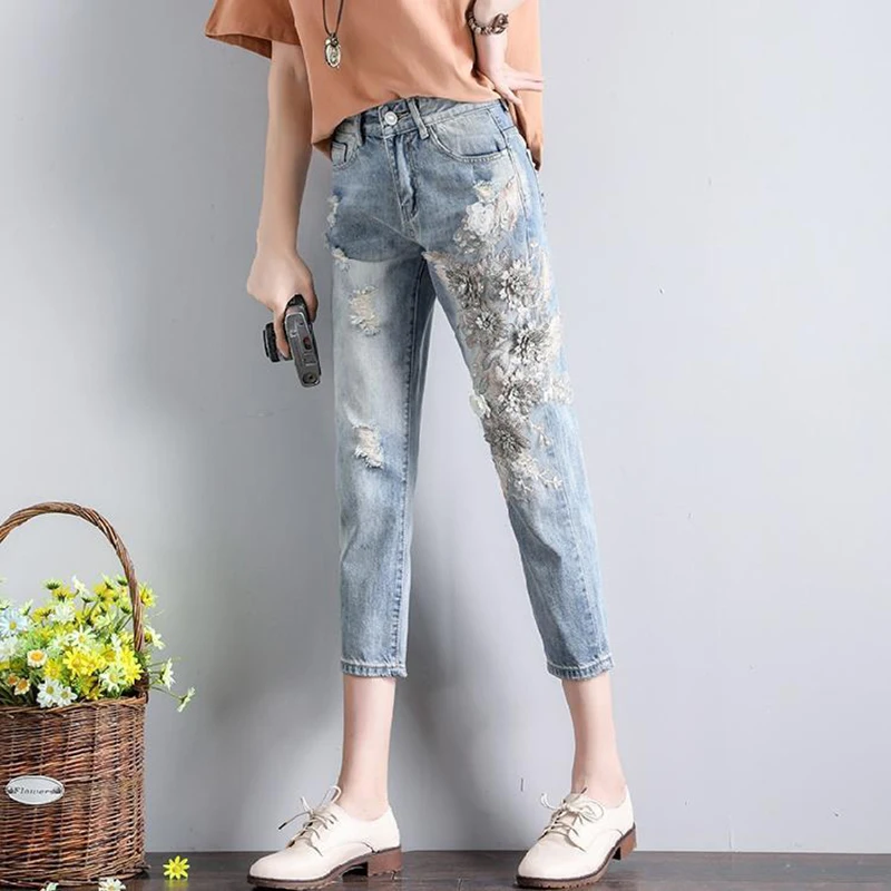 

Early Autumn Women's Korean Edition New Flower Embroidery Heavy duty Cowboy Small Foot Casual Nine point Pants Trendy
