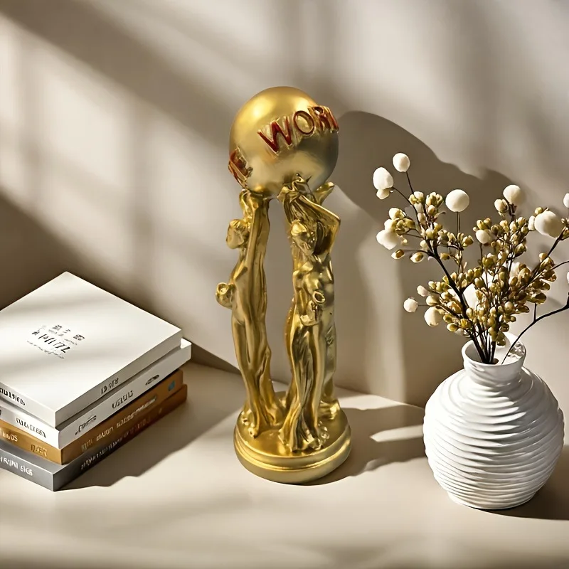 Three People Holding A Ball with Golden Textureand Carved Text: The World Isyours,creating An Inspiringatmosphere for Decoration