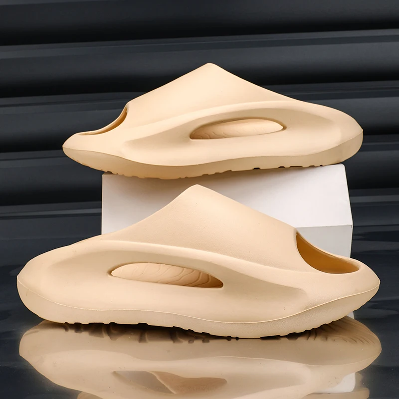 

Yezzy EVA Мужские сандалии Мягкие полые парные садовые туфли Дизайнерские женские тапочки с отверстиями Кроссовки Пляжная обувь для воды Slip on Foam Runner