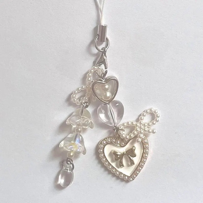 

Брелок для телефона ручной работы с бусинами в виде лилии, бантом и сердечком, в стиле Лолита, сказочный, в стиле фейри-кор