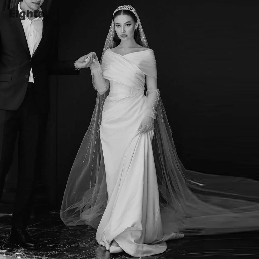 ชุดแต่งงานแบบอาหรับสีขาวงาช้าง ทรงเมอร์เมด ผ้าซาติน แบบเปิดไหล่ จีบระบาย  รับตัดตามสั่ง