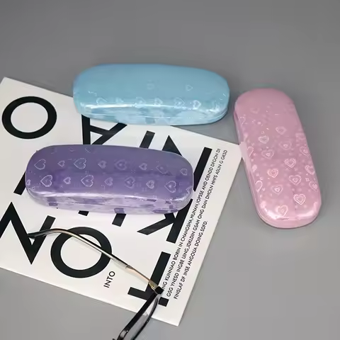 A sparkling PU leather glasses case with a heart-shaped pattern, a pressure resistant portable sunglasses storage box