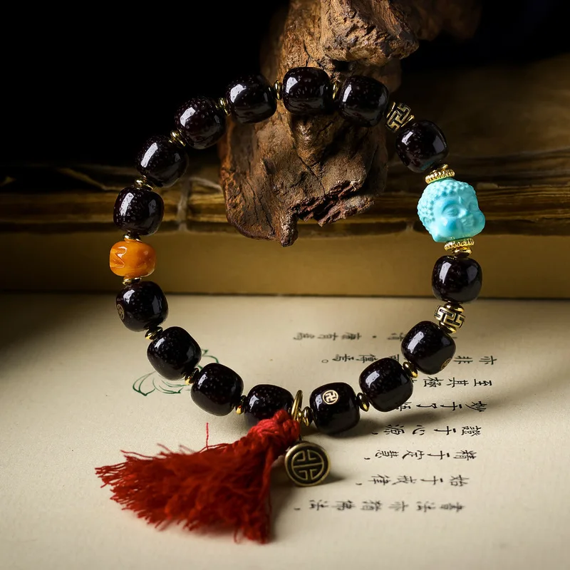 Cinnabar inlaid bracelet with a diamond-shaped pattern featuring magnesite turquoise and a Buddha head a traditional Chinese