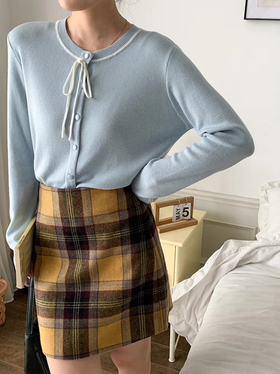 Kardigan rajut leher bulat dengan dasi kupu-kupu desain baru awal musim gugur.