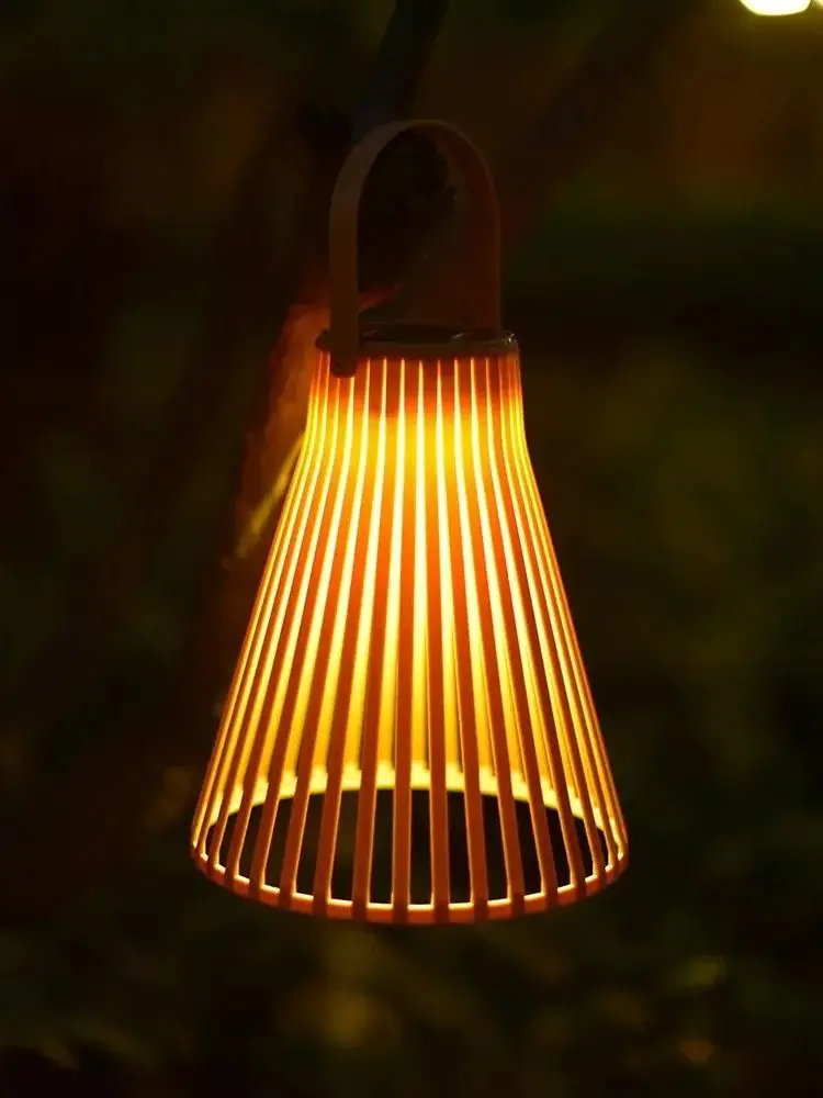 SoraWeave solar light displaying warm projection pattern on outdoor balcony wall