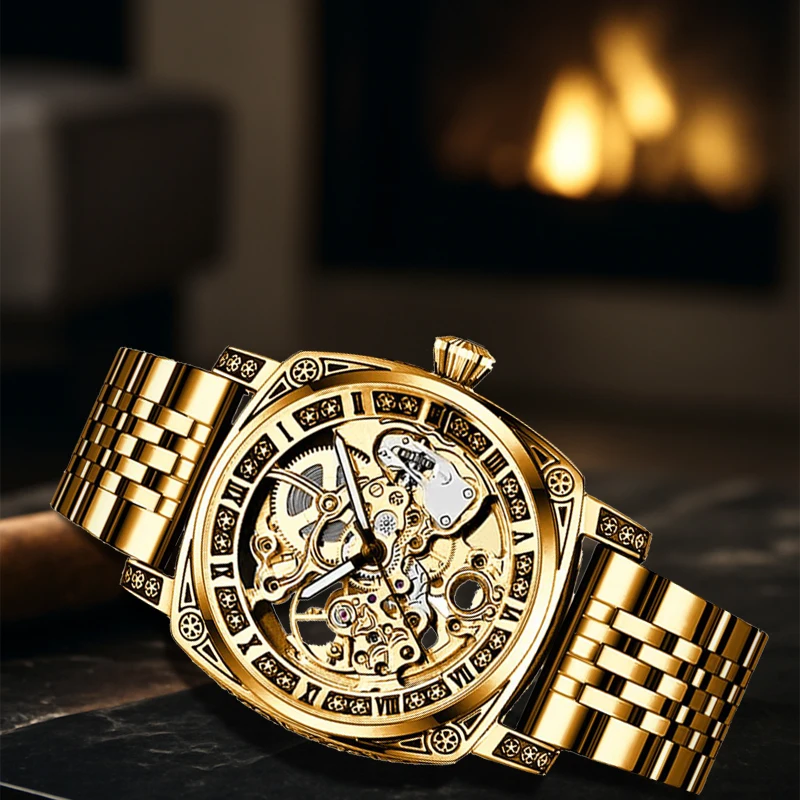 

A men's gold-toned steel strap business vintage engraved engraved analogue automatic mechanical watch