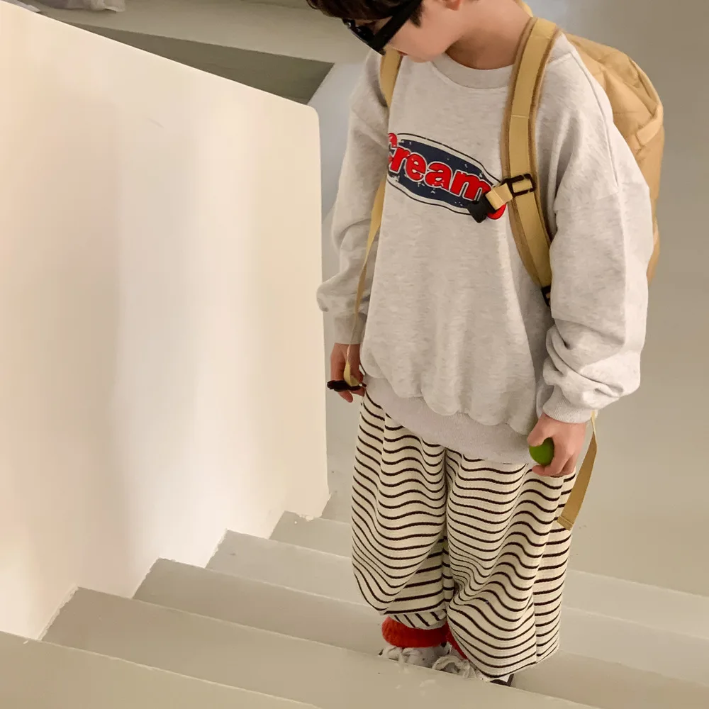 Felpa con cappuccio per bambini 2024 primavera stile coreano lettera stampata ragazzi e ragazze Casual girocollo manica lunga Casual allentato Top