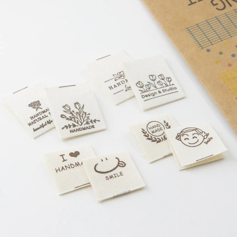 Hand-folded spot shipping mark head tulip bouquet smiling face cloth label accessories sewing DIY side label.