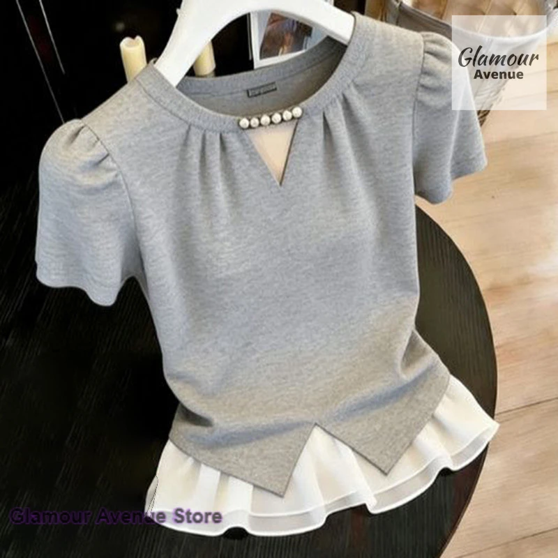 French style temperament contrast hollow shirt female spring and summer new fashion commuter Joker Royal Sister huge nice top.