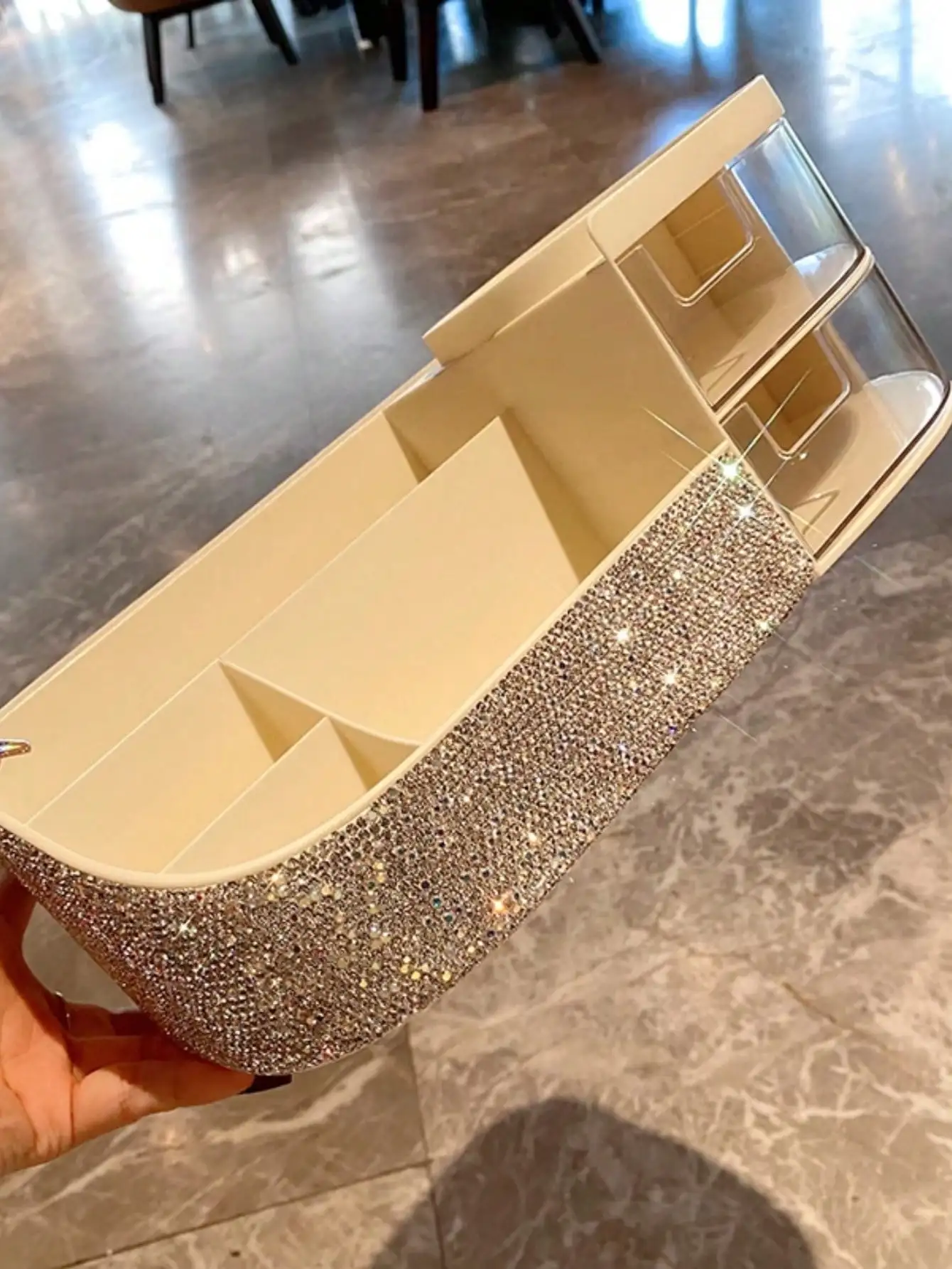 One artificial diamond-encrusted makeup brush and a drawer-style storage box for skin care products