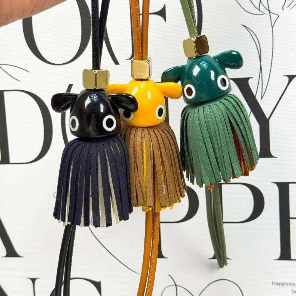 Genuine Leather Big Eye Tassel Bag Charm Luxury Designer Inspired Fringe Keyring For Women Handbags Backpacks Tote Accessories