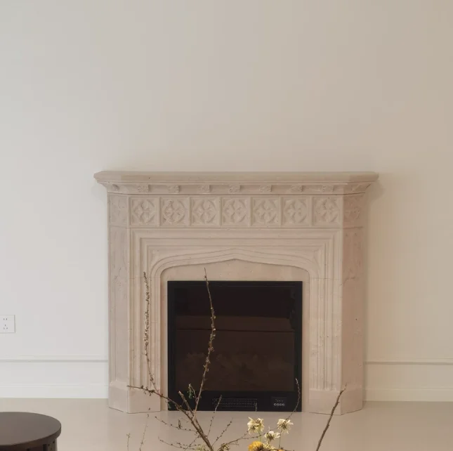 Hand Carved Indoor Fireplaces for Hotels and Villas Designer Freestanding Beige Marble Fireplace