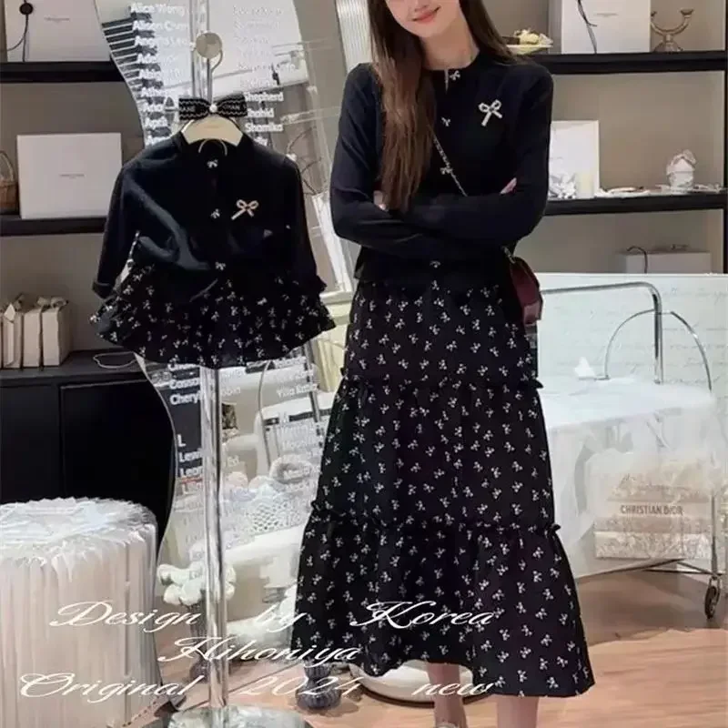 ถักเสื้อสเวตเตอร์ถักผู้หญิงแฟชั่นภาษาฝรั่งเศสคําปุ่มโบว์เสื้อผ้าสตรีสีดําสั้นเสื้อกันหนาวเสื้อ Slim เสื้อถัก