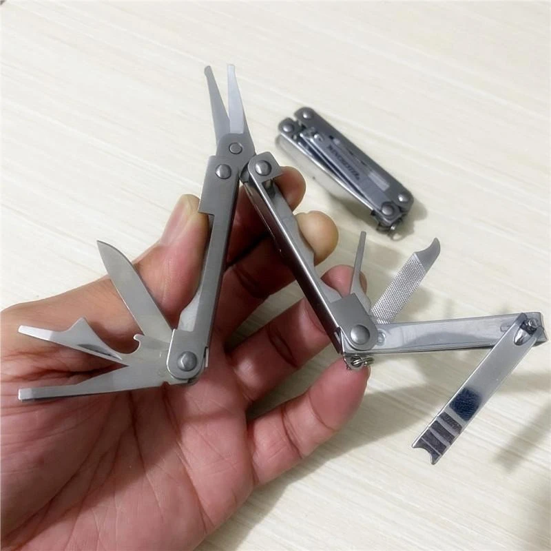 Multifunctional folding combination tool nail scissors portable bottle opener