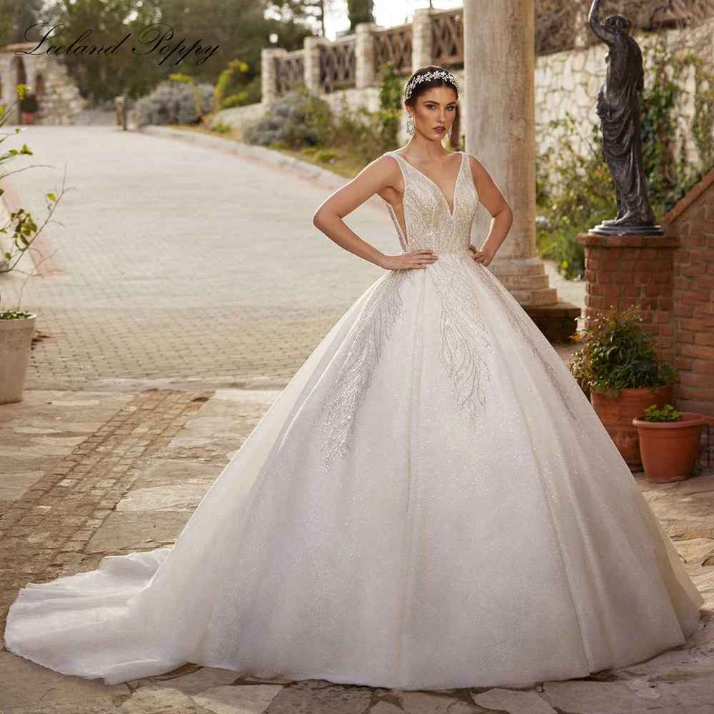 

Lceland Poppy Customized V Neck Ball Gown Wedding Dresses Sleeveless Beaded Lace Backless Bridal Gowns with Court Train