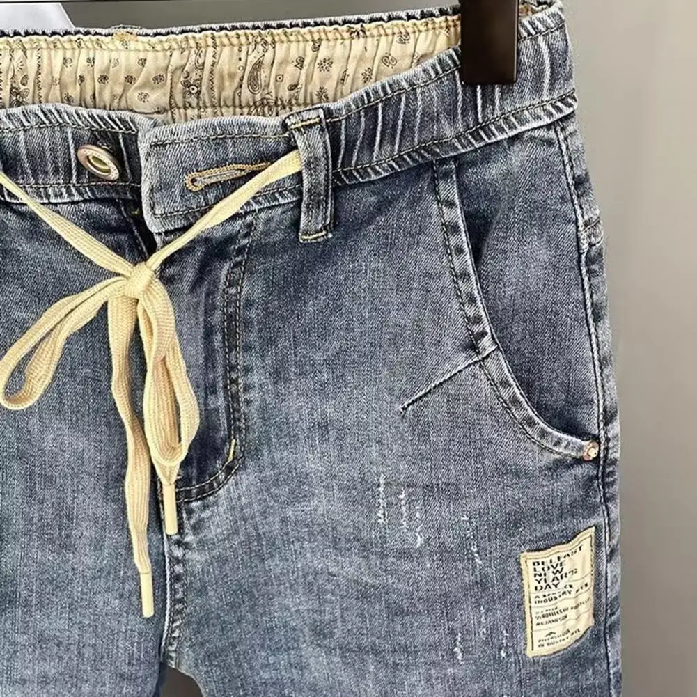 Celana Denim pria, Jeans Harem gaya Hip Hop, pinggang elastis dapat disesuaikan tali serut ritsleting