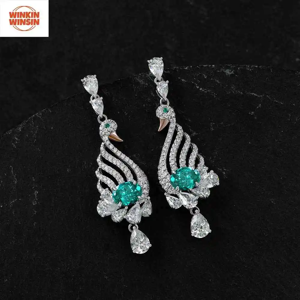 

Winkin Winsin S925 Silver Oval 2 Carat Lotus Cut Paraiba Swan Earrings