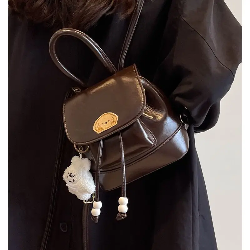 High Quality Hot Selling Wholesale New Niche Design Retro Fashion Backpack Large Capacity with Pendant Cartoon Crossbody PU Bag