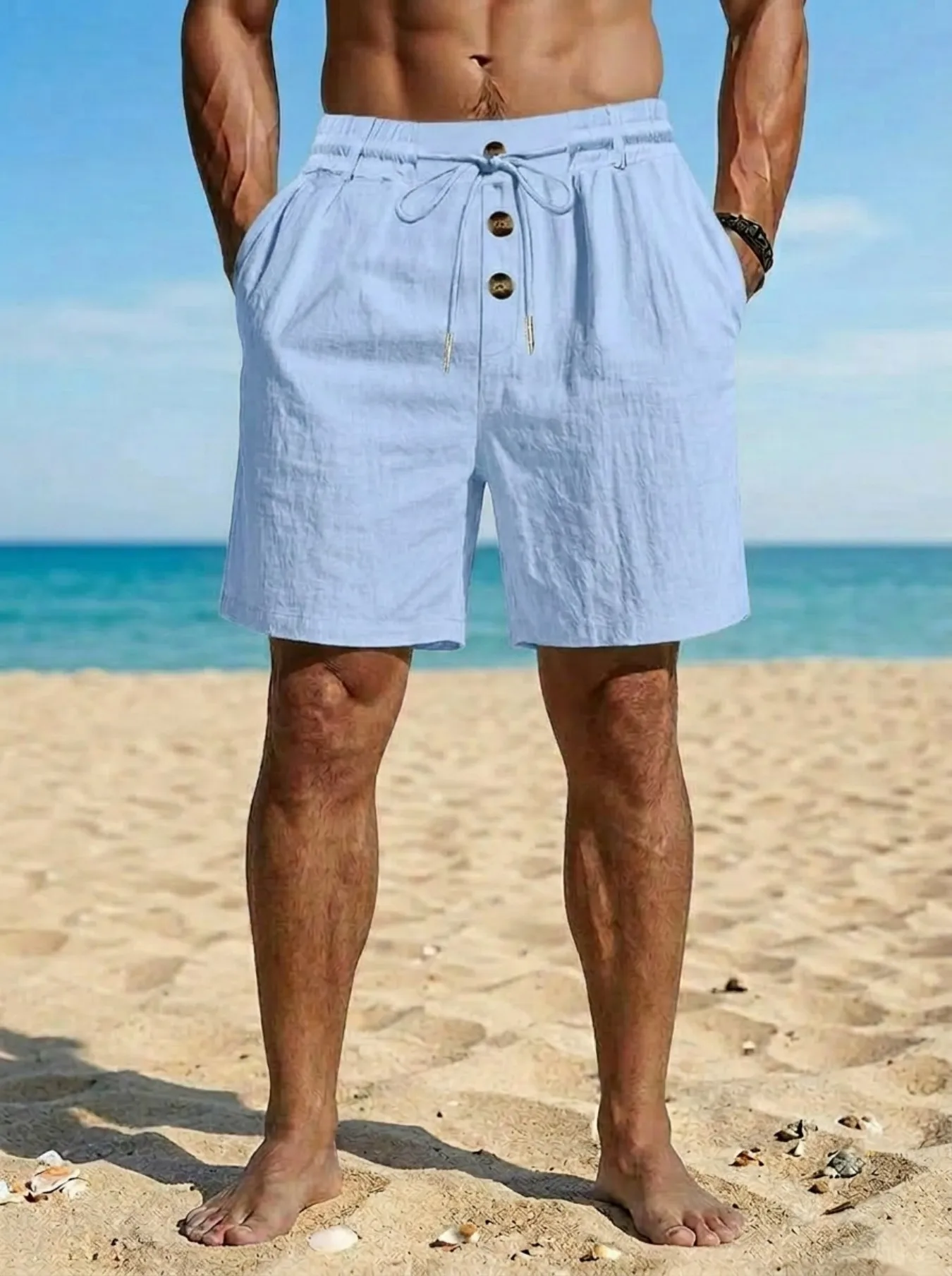 

Men's lightweight cotton-linen shorts with elastic waistband and drawstring, featuring a button-front closure for casual beach