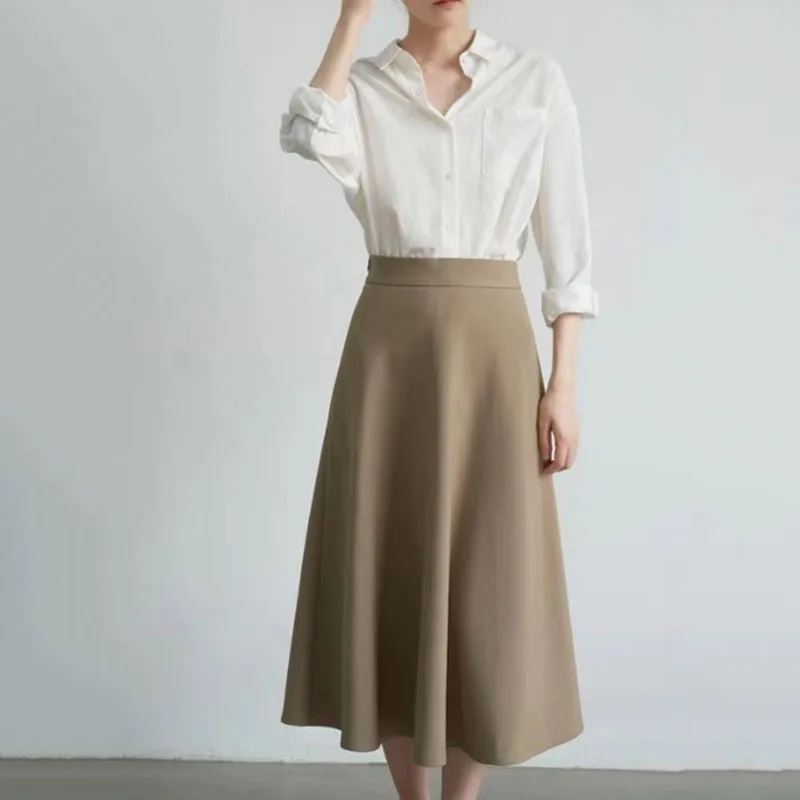 

Сплошной цвет, простая темпераментная длинная юбка для женщин, новинка 2023 года, утягивающие офисные юбки-миди с высокой талией, повседневные свободные юбки трапециевидной формы