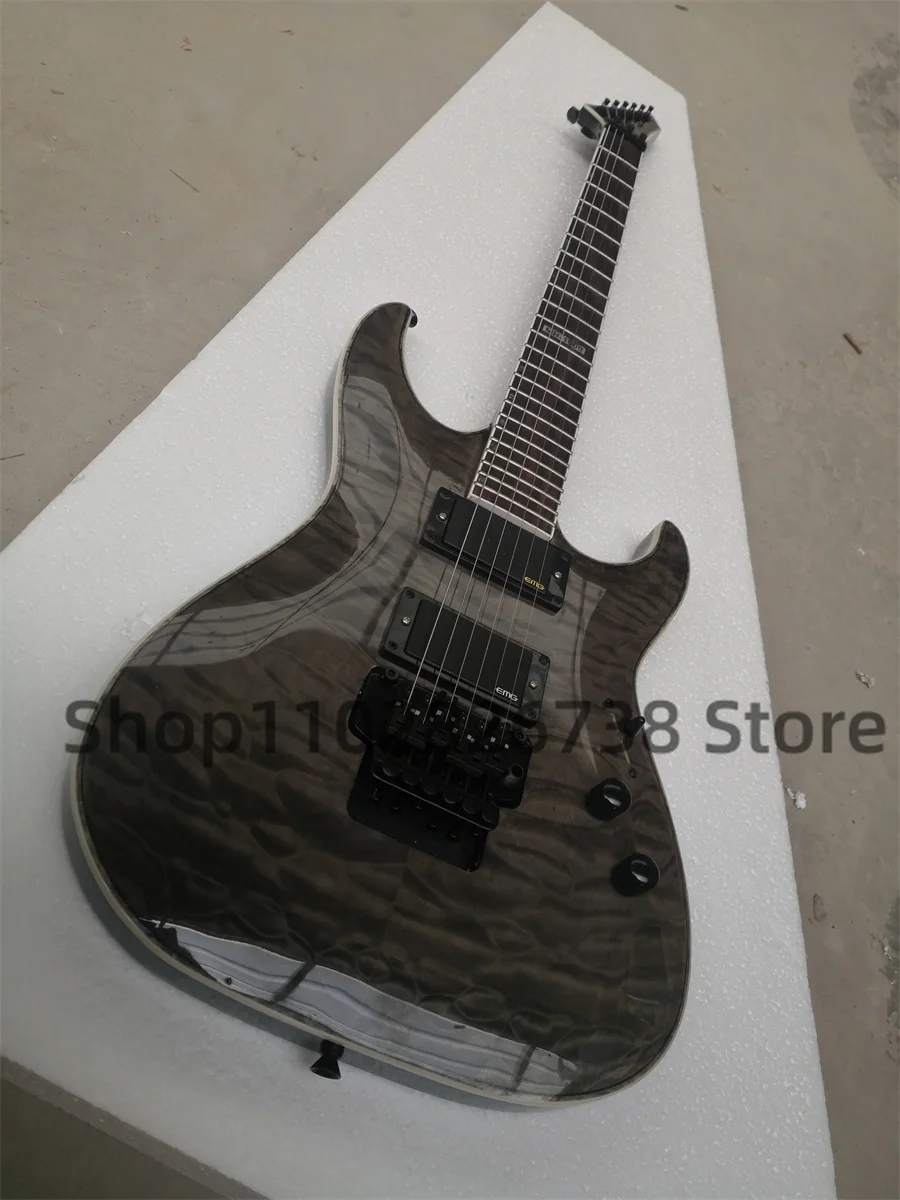 Clear black electric guitar Squilted Maple Top Maple neck Set In body Rosewood fingerboard 1000 inlaid tremolo bridge closed pic